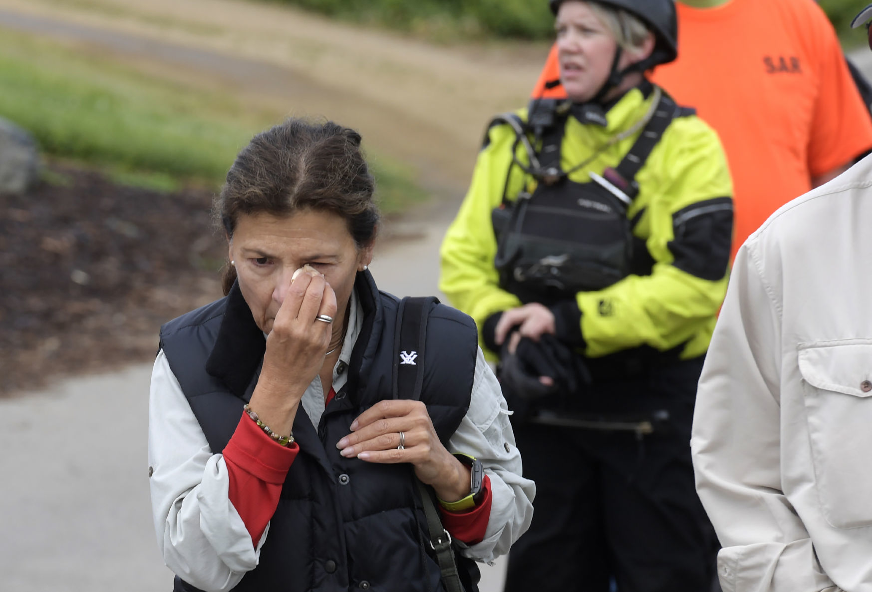 A bystander walks away